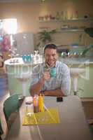 Man having coffee in restaurant