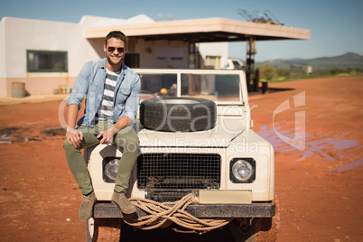 Man sitting on a car