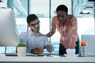 Executives working together at desk