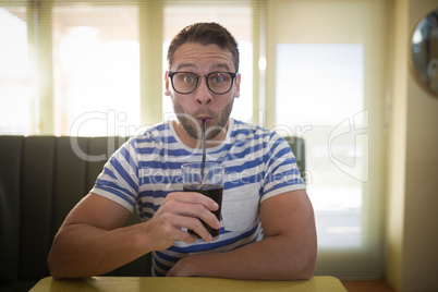 Man having drink in restaurant