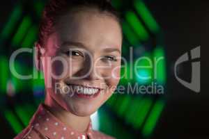 Smiling female executive in futuristic office