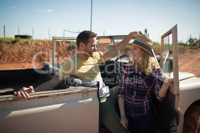 Couple relaxing in their car on a sunny day