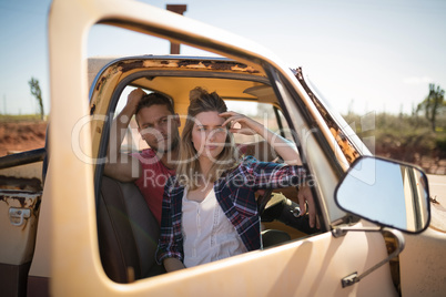 Couple sitting together in a car