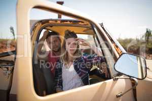 Couple sitting together in a car