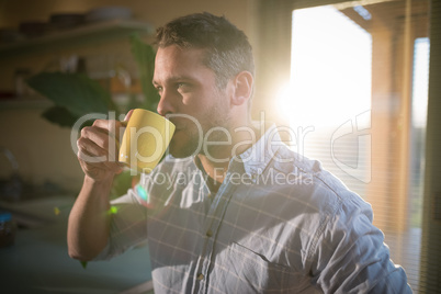 Man having coffee in restaurant