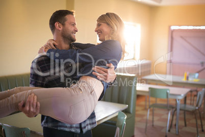 Couple romancing in restaurant