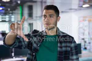 Male executive gesturing in office