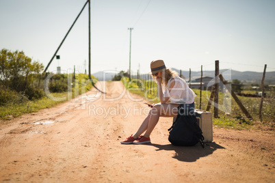 Woman using mobile phone on a sunny day