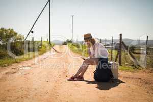 Woman using mobile phone on a sunny day