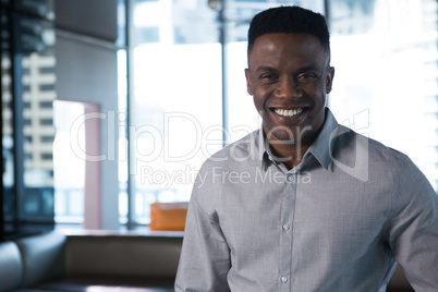 Male executive smiling in office