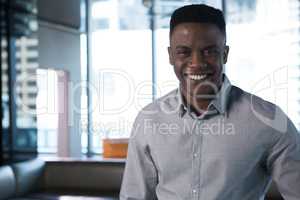 Male executive smiling in office