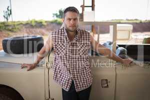 Man standing near his car