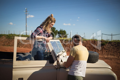 Couple looking at map on a sunny day