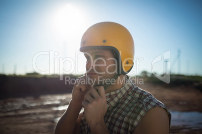 Man wearing a helmet on a sunny day