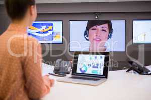 Female executive having video call in boardroom