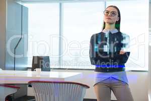 Female executive looking at digital screen