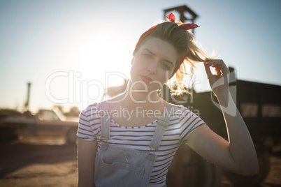 Woman holding her hair on a sunny day