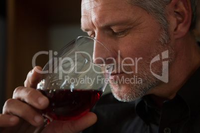 Waiter drinking wine