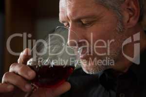 Waiter drinking wine