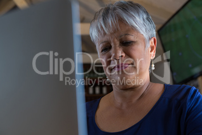 Waitress using laptop