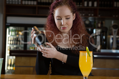 Waitress making a drink