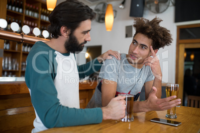 Man comforting his depressed friend