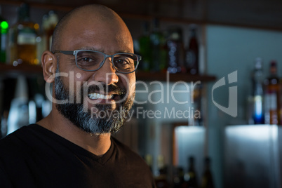 Man smiling in the bar