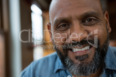 Man smiling in cafe