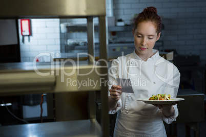 Female chef reading order