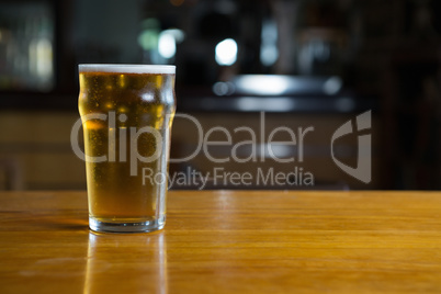 Close-up of beer glass on the counter