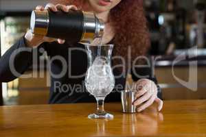 Waitress making a drink