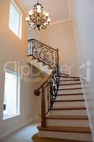 Staircase and chandelier at home