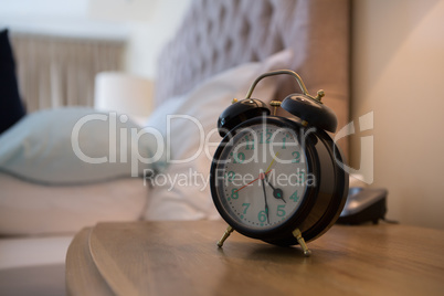 Close-up of alarm clock on table