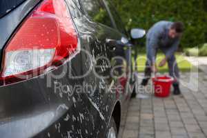 Auto service staff washing a car