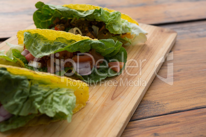 Mexican tacos on wooden tray