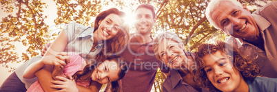Happy family smiling in park