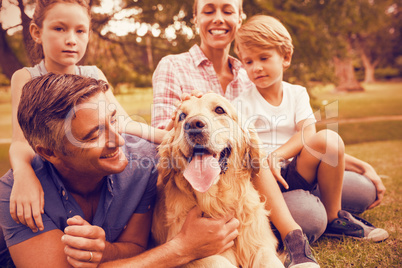 Happy family enjoying with dog at park