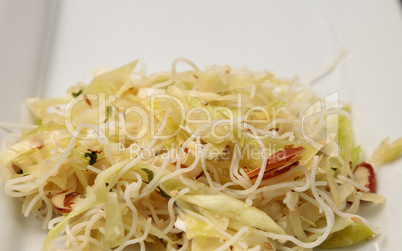 Healthy Asian cabbage, rice pasta and almond salad