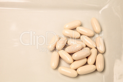 White gel capsules of vitamin Co Q-10