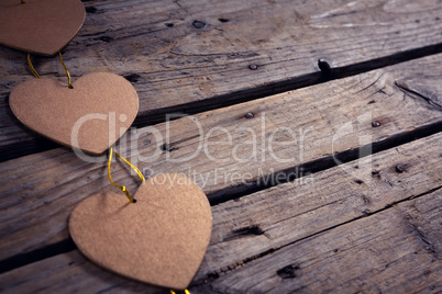 Heart shaped christmas decoration on wooden plank