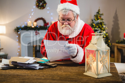 Santa Claus reading a letter