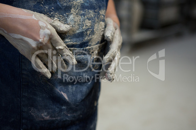 Girl with muddy hands