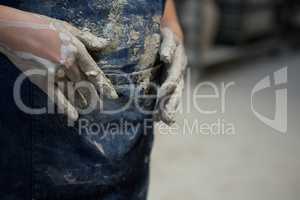 Girl with muddy hands