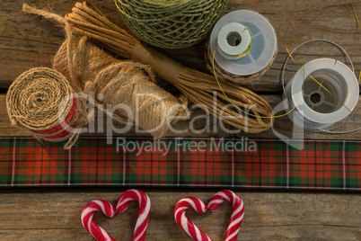 Overhead view of thread spools with candy cane