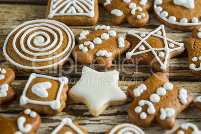 Gingerbread cookies arranged on wooden plank