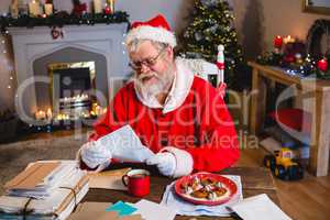Santa Claus reading a letter