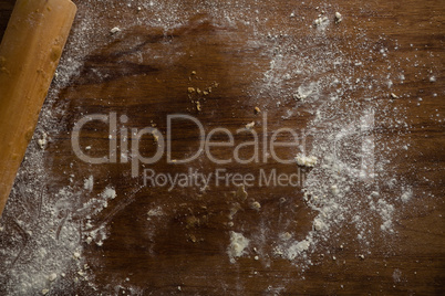 Left over flour after flattening dough on a wooden table