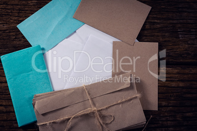 Various envelopes on wooden plank