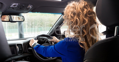 Side view of customer driving in car