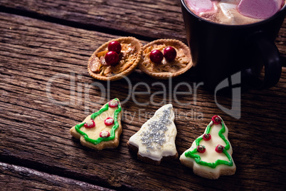 Christmas cookies on wooden plank